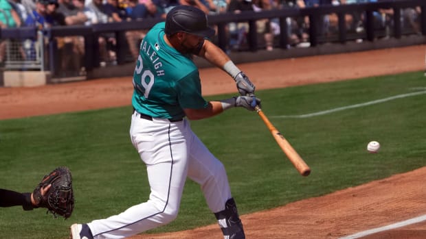 Mar 14, 2024; Peoria, Arizona, USA; Seattle Mariners catcher Cal Raleigh (29) bats against the Milwaukee Brewers during the first inning at Peoria Sports Complex.